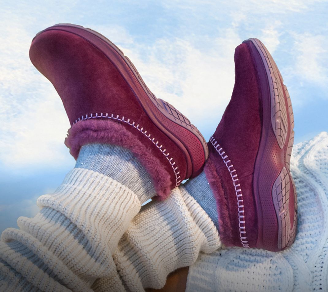 Person tying Merrell running shoes